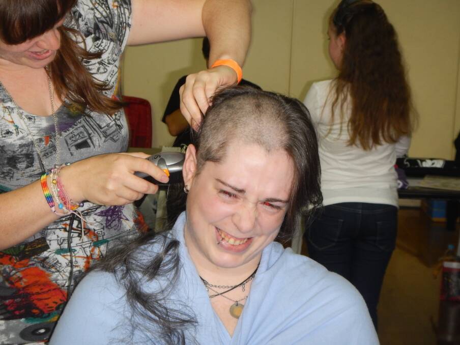 BRAVE: Andy ‘Random’ Berglund has her head shaved for cancer research. Picture: CONTRIBUTED
