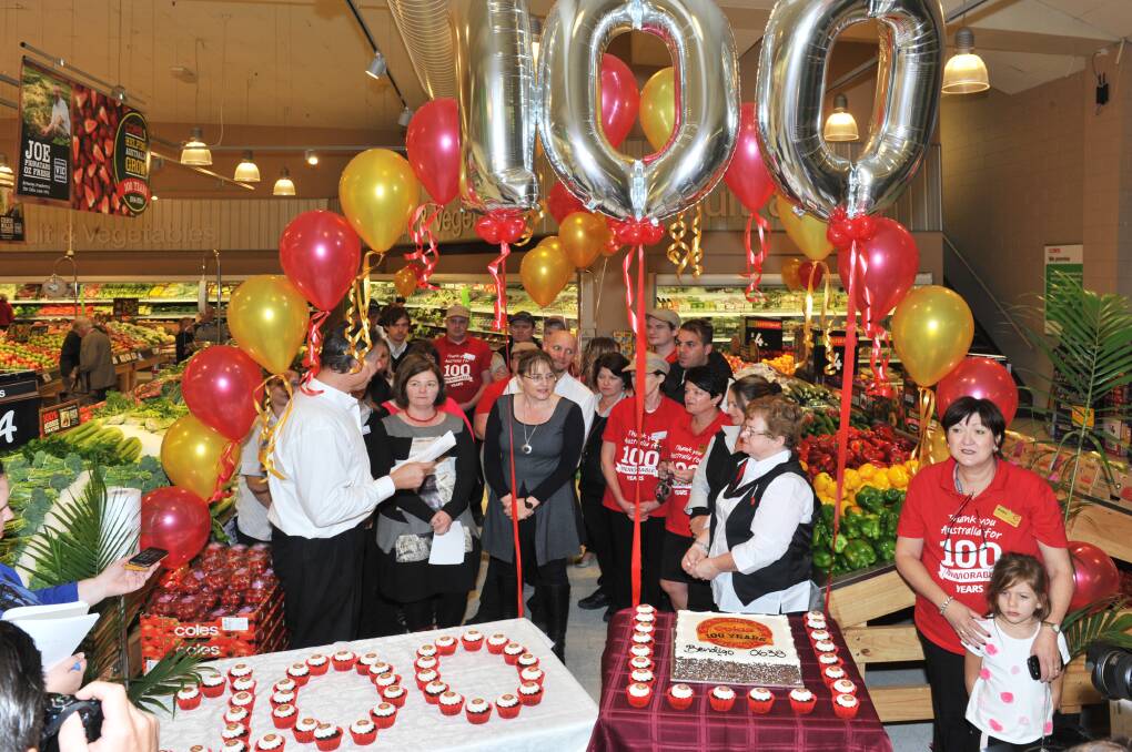 SPECIAL CEREMONY: Coles celebrates its 100th birthday with balloons and cakes. Picture: BRIAN SEMMENS
