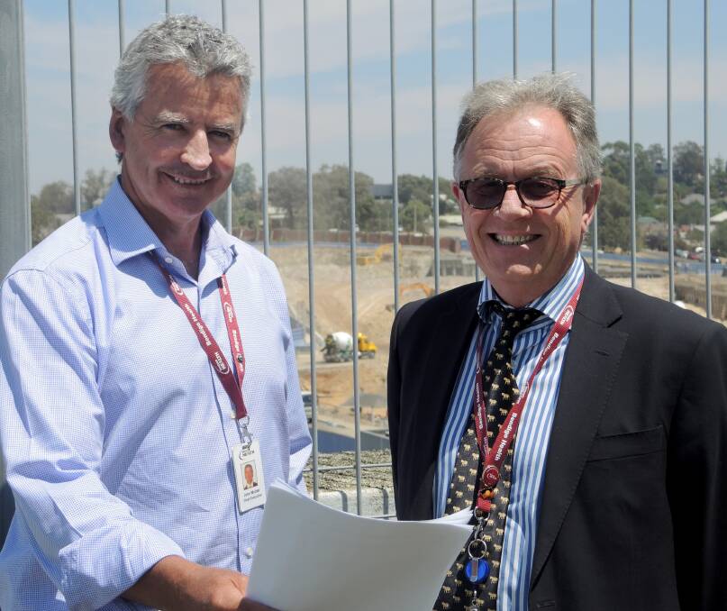 BUSY: Bendigo Health chief executive officer John Mulder with executive director of nursing and surgical services Peter Faulkner. Picture: HANNAH KNIGHT