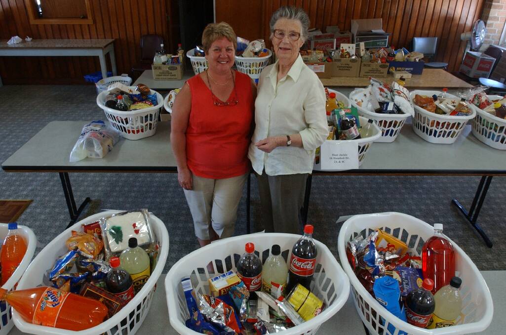 Janice Normington and Mary Coman among the St Vincents hampers at Cathedral Hall. Pic Brendan McCarthy