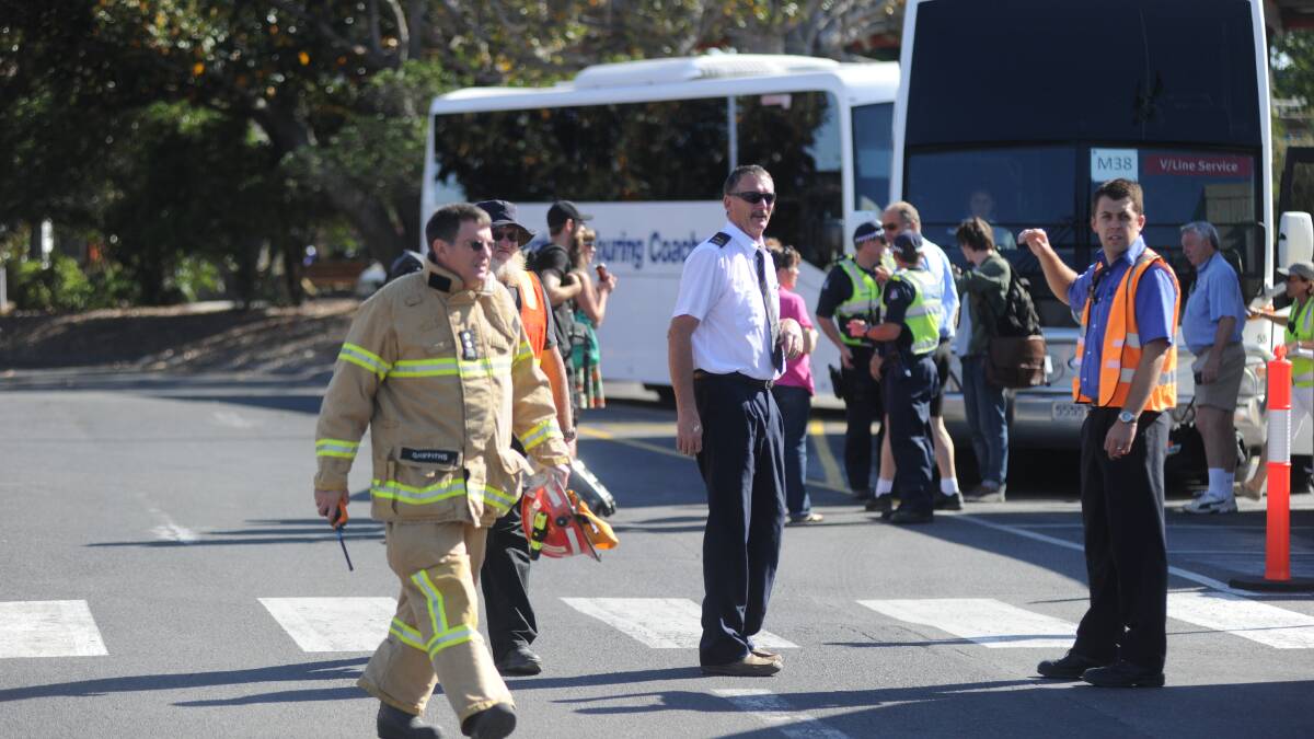 EVACUATED: People are ushered from the scene amid safety fears. Picture: BLAIR THOMSON