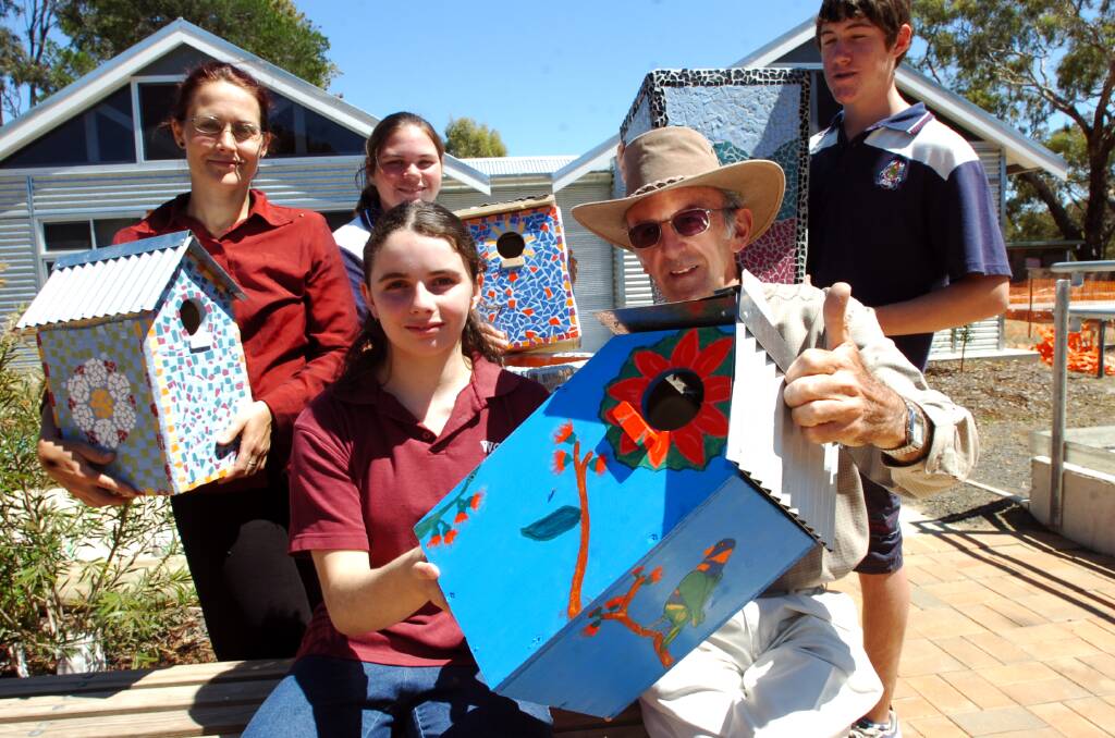 Graham Neivandt from the Camp Getaway Campsite Committee, recieves some of the items made by Weeroona College students Karen McVilly Alpine School Co-ordinator, Renata Coppola, Jacob Barnes and Erin Gilmour. Picture ; PETER HYETT.