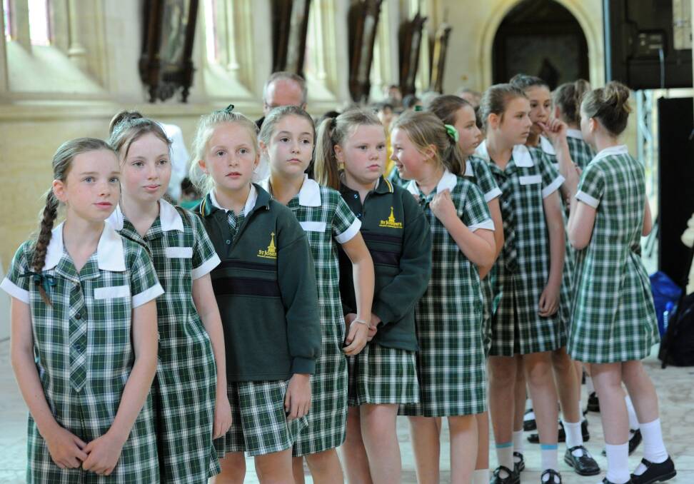 EXCITED: St Joseph's Primary School students line-up. 