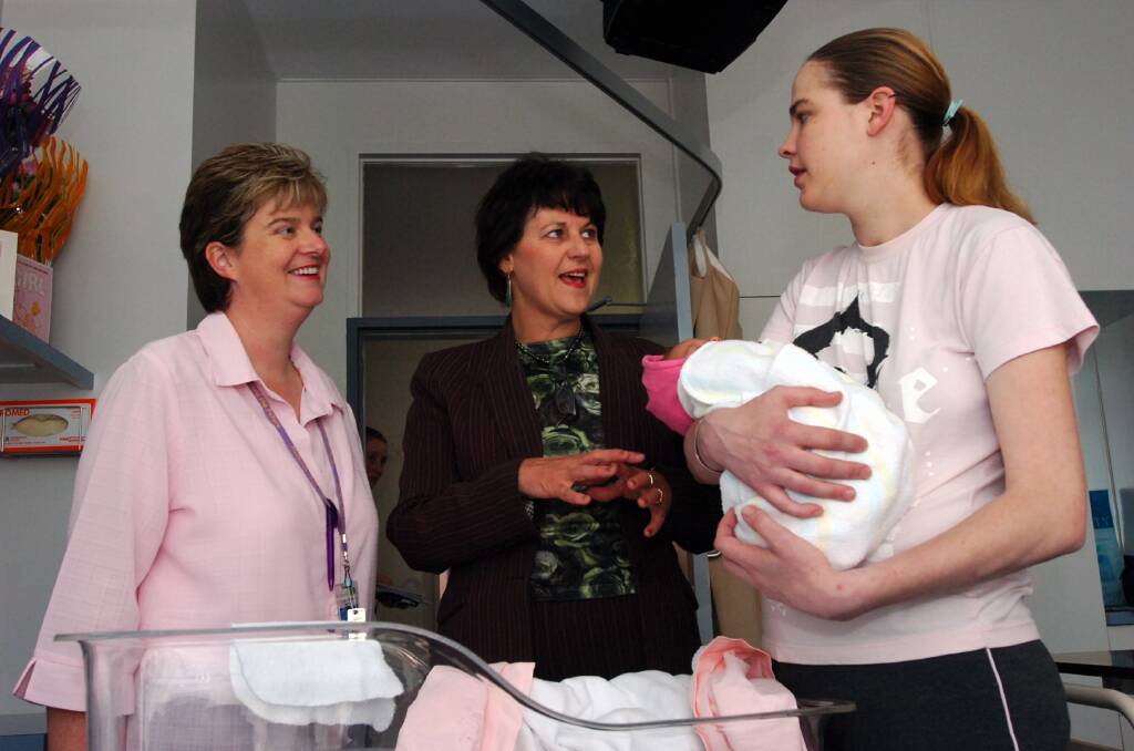 Debbie Rogers (Bgo Health Care ), Minister for Health Bronwyn Pike with Jayde Paooard and her new baby Amber.
pic by ANdrew perryman