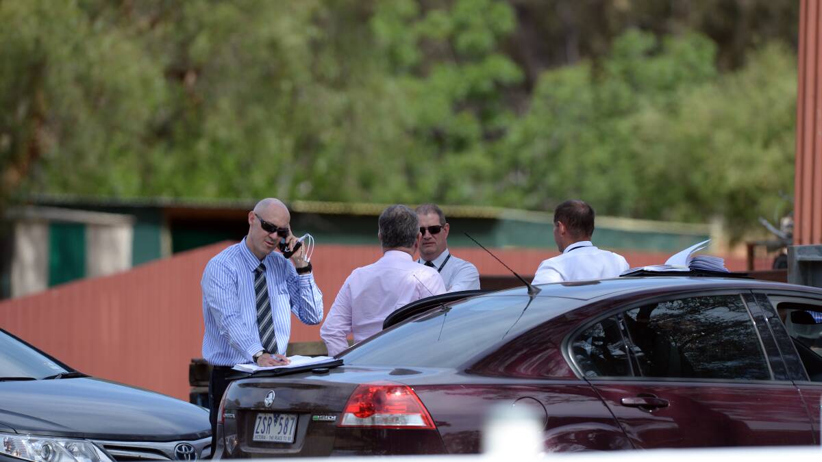 Investigators at the scene in Wedderburn following the shootings last October. Picture: BILL CONROY