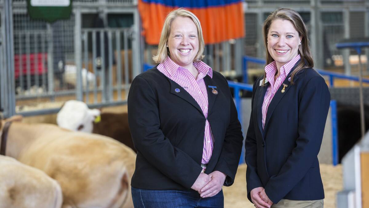 Bendigo DEPI red meat researcher Melissa Neal, right, received the Rural Ambassador Award at the Royal Melbourne Show on Saturday.