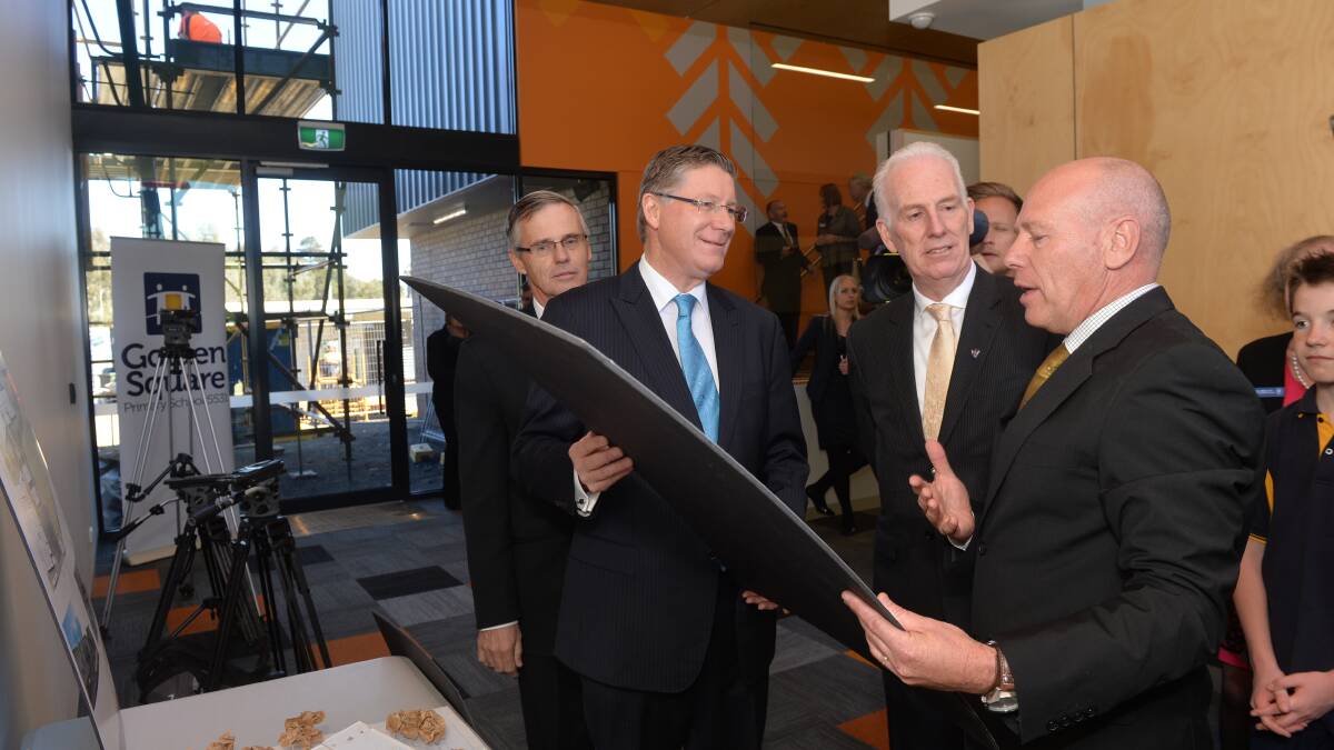 PLANS: Premier Denis Napthine and principal Barry Goode with the school plans. Picture: BRENDAN McCARTHY
