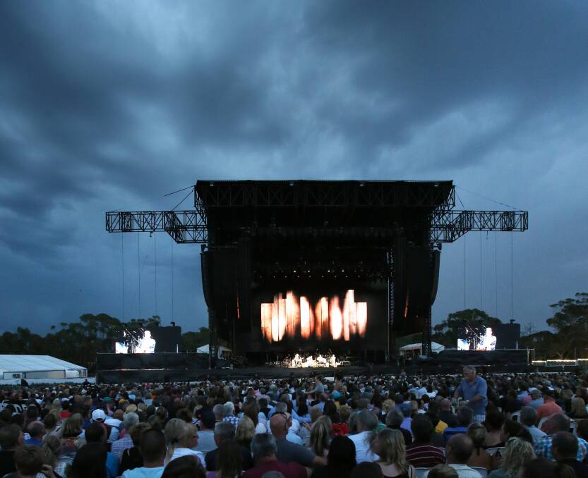 Storm clouds circle as the Eagles perform at Hanging Rock. Picture: PETER WEAVING