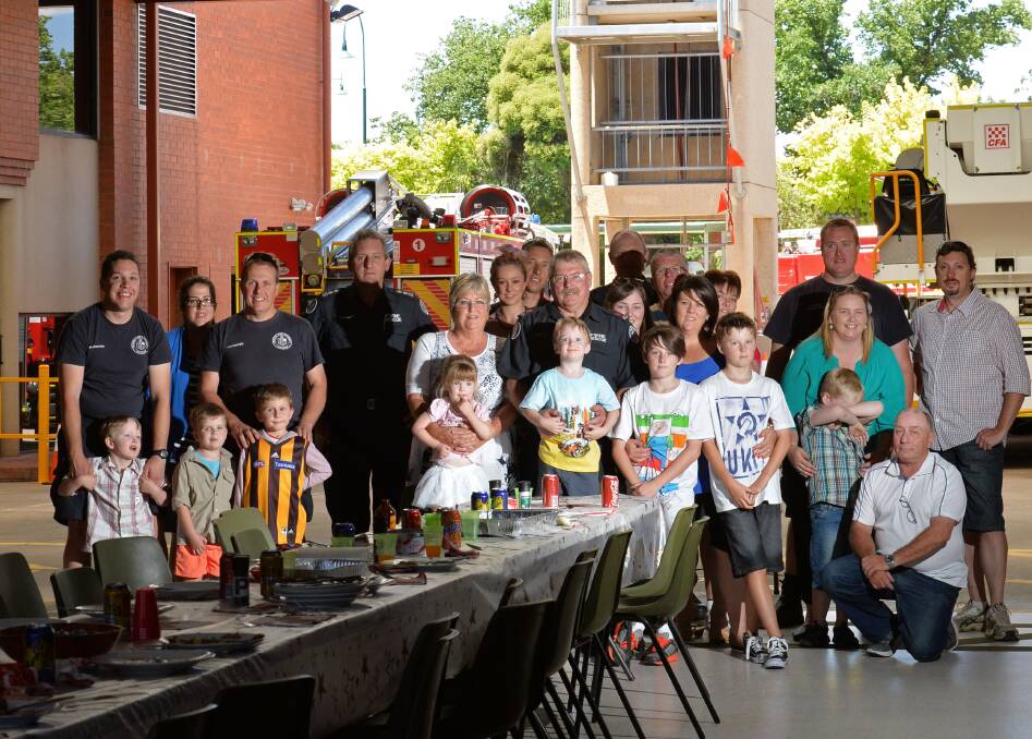 CHEERS: CFA firefighters and family enjoy lunch. Picture: JODIE DONNELLAN