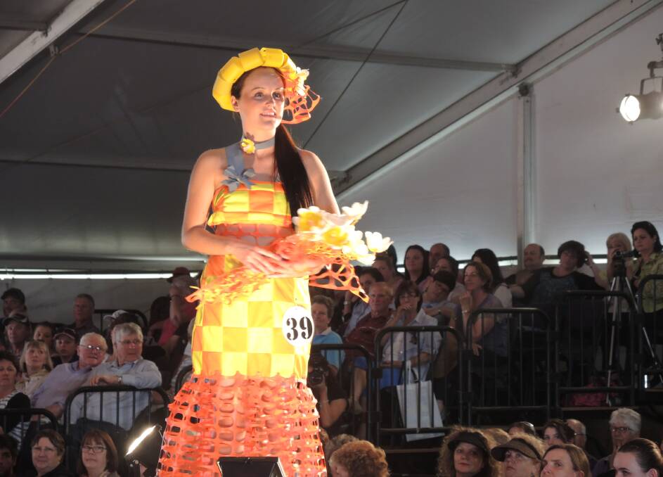 A dress made entirely of used farm safety signage and barriers.