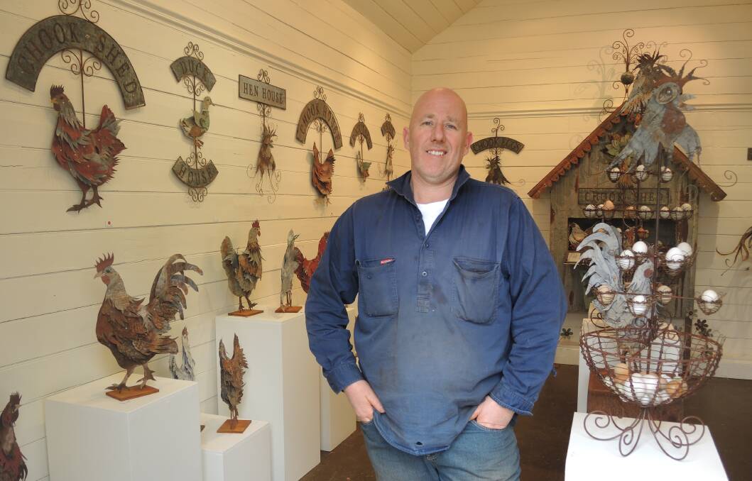ORIGINAL: Peter Gray, of Shades of Gray gallery and studio, with the chickens and ducks at the centre of their 2014 exhibit. Picture: ADAM HOLMES