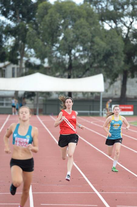 Kate Salvador, Stephanie Pompei and Jemimah Bish race to the line in the women's 300m. 