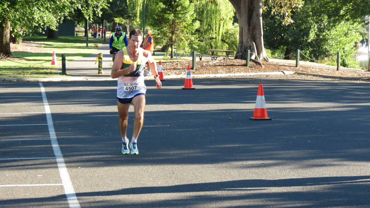 Shawn Claydon races around Lake Weeroona in the Oceania Masters half-marathon in Bendigo. Picture: HUNTER GILL