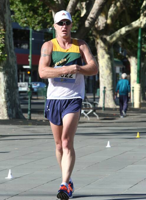 FIRST TO FINISH: Brisbane's Dean Nipperess completes the 10km walk in 48.39 and wins gold in the 40-44 years class at the Oceania Masters athletics championships in Bendigo. Picture: PETER WEAVING 