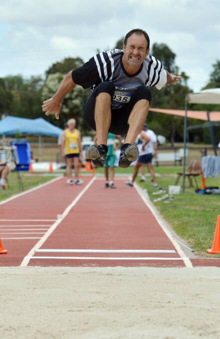 FLYING HIGH: New Zealand's Bruce Solomon contests long jump in the 50-54 years decathlon. Picture: BRENDAN McCARTHY 