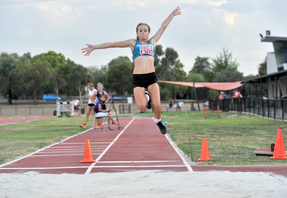 FINE STYLE: Kate Salvador from Bendigo Harriers achieved a best of 4.35m to be runner-up in the long jump at Friday night's competition. Picture: JODIE DONNELLAN