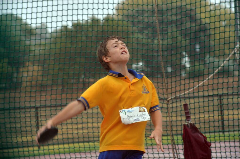 Patrick Hannaford competes in the under-9 discus event. 