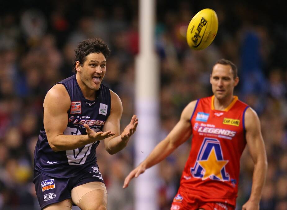TOO QUICK: Brendan Fevola on the lead for Victoria in last year's E.J. Whitten Legends match. Picture: GETTY 