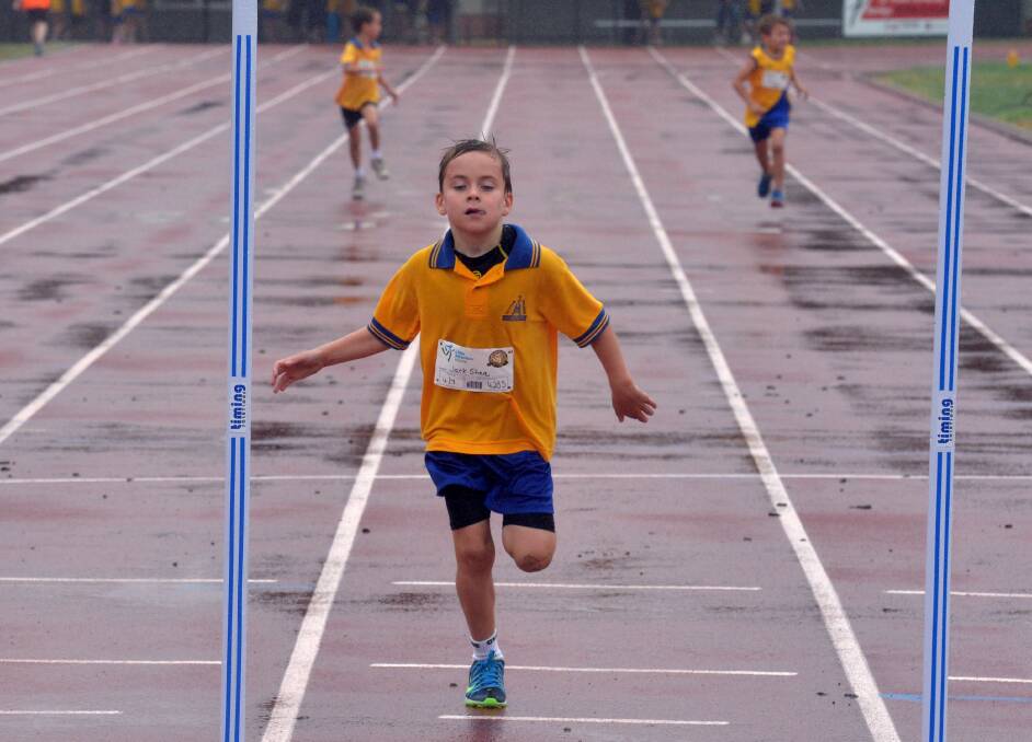 Jack Shae races to the finish line in the under-7 200m. 