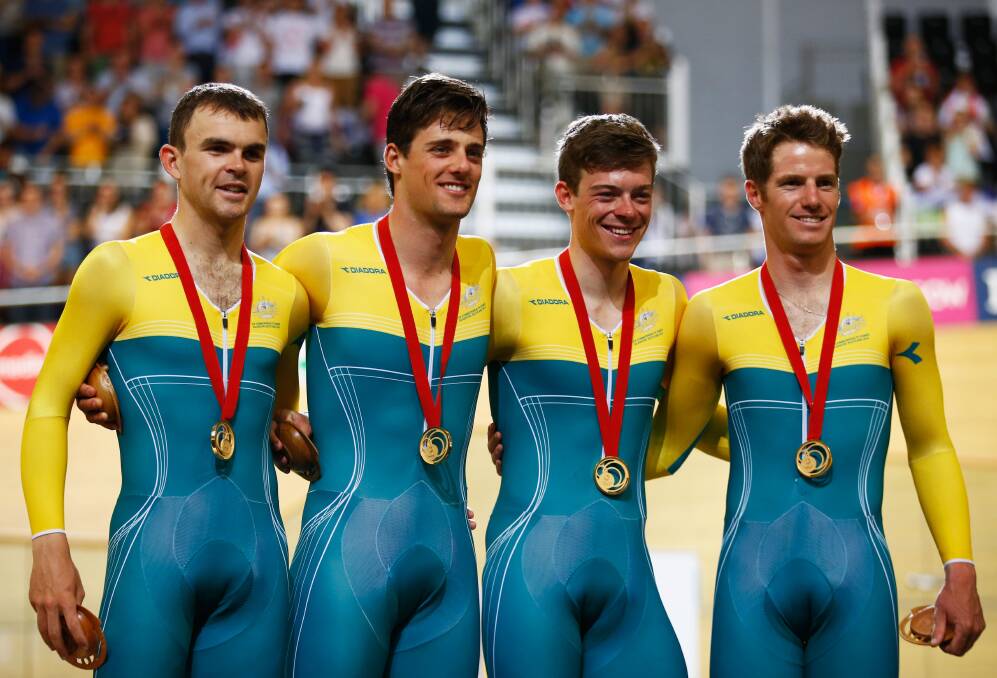 FAB FOUR: Australian Cyclones team-mates Jack Bobridge, Luke Davison, Alex Edmondson and Glenn O'Shea after being presented with the gold medals for winning the 4000m teams pursuit final at Sir Chris Hoy Velodrome on day one of the Glasgow 2014 Commonwealth Games. Picture: GETTY 