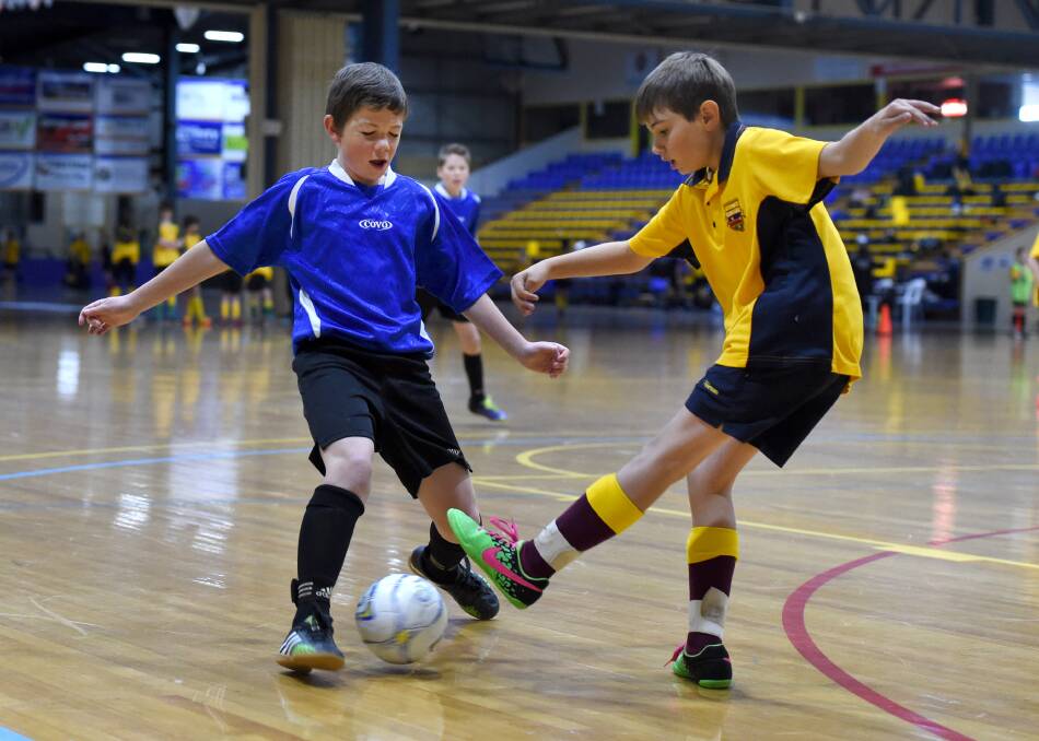 DUEL: Action from the Bendigo region futsal titles.  