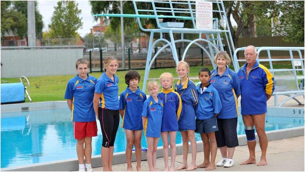 BY THE POOL: Some of the Bendigo Divers members and long-time coach Heather Tyter at Bendigo Aquatic Centre in Barnard Street. 
