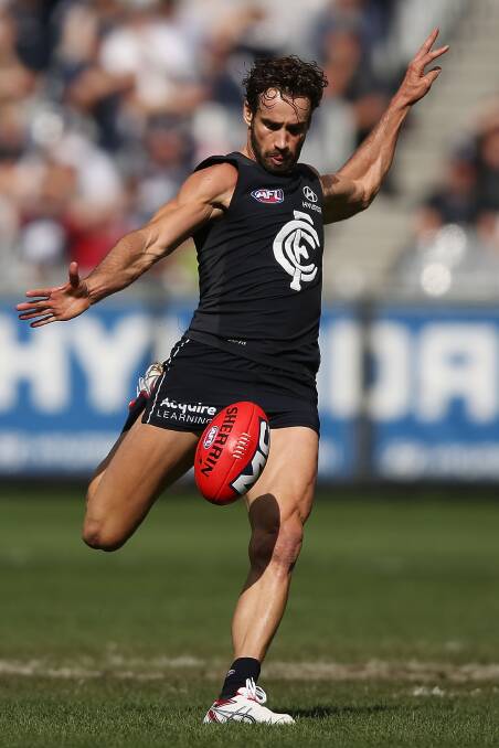 KICK IT LONG: Andrew Walker in action for Carlton at the MCG. Picture: GETTY 