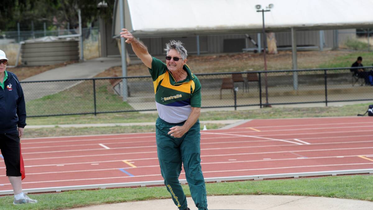 Guy Quarterman competes in the 70-74 years shot put. 