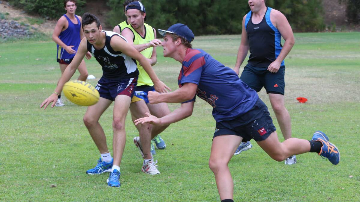 Seb Greene handballs on the run in the Dragons' workout at Ewing Park. Picture: PETER WEAVING 