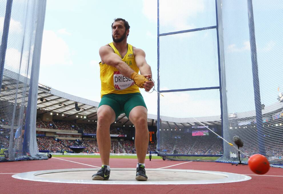 SEASON-BEST: Tim Driesen competes in qualifying for the hammer throw at the Glasgow 2014 Commonwealth Games. Picture: GETTY 