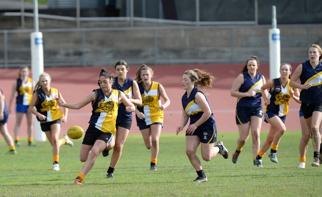 SKILFUL: Bendigo Senior SC's Ruby Campbell kicks in the Lions clash with Castlemaine SC. Picture: JIM ALDERSEY