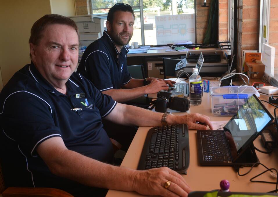 Bowls Victoria's Peter Delaney and Paul Winslow hard at work at the state champios week at Bendigo East Bowling Club. 