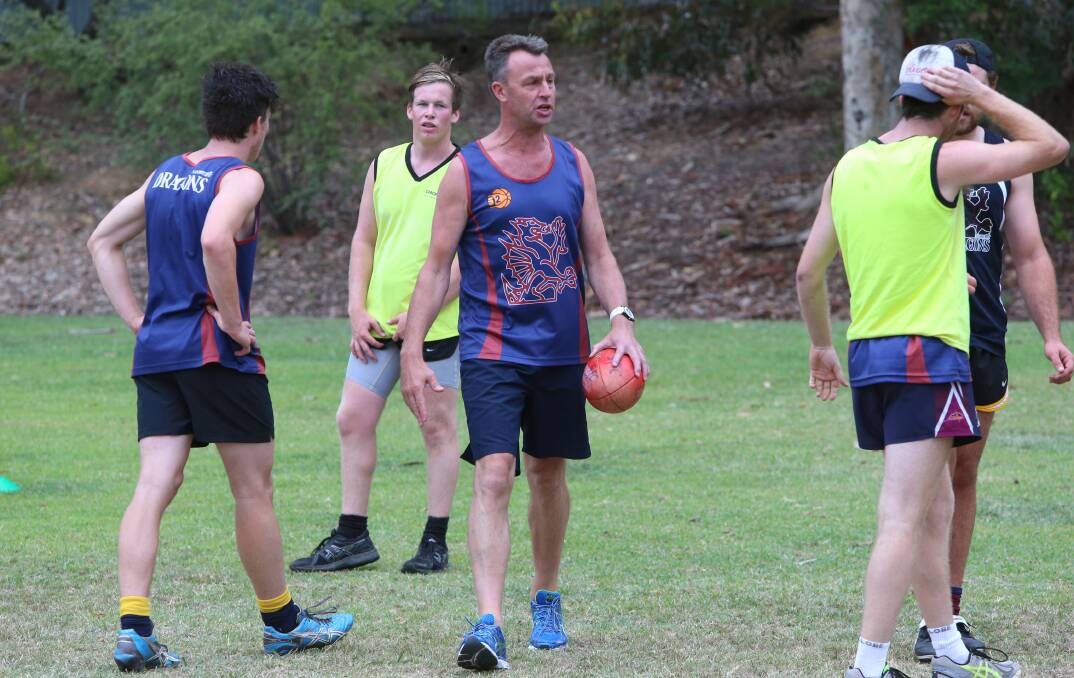 New senior coach Brett Fitzpatrick, centre, at the Dragons workout.  Picture: PETER WEAVING 