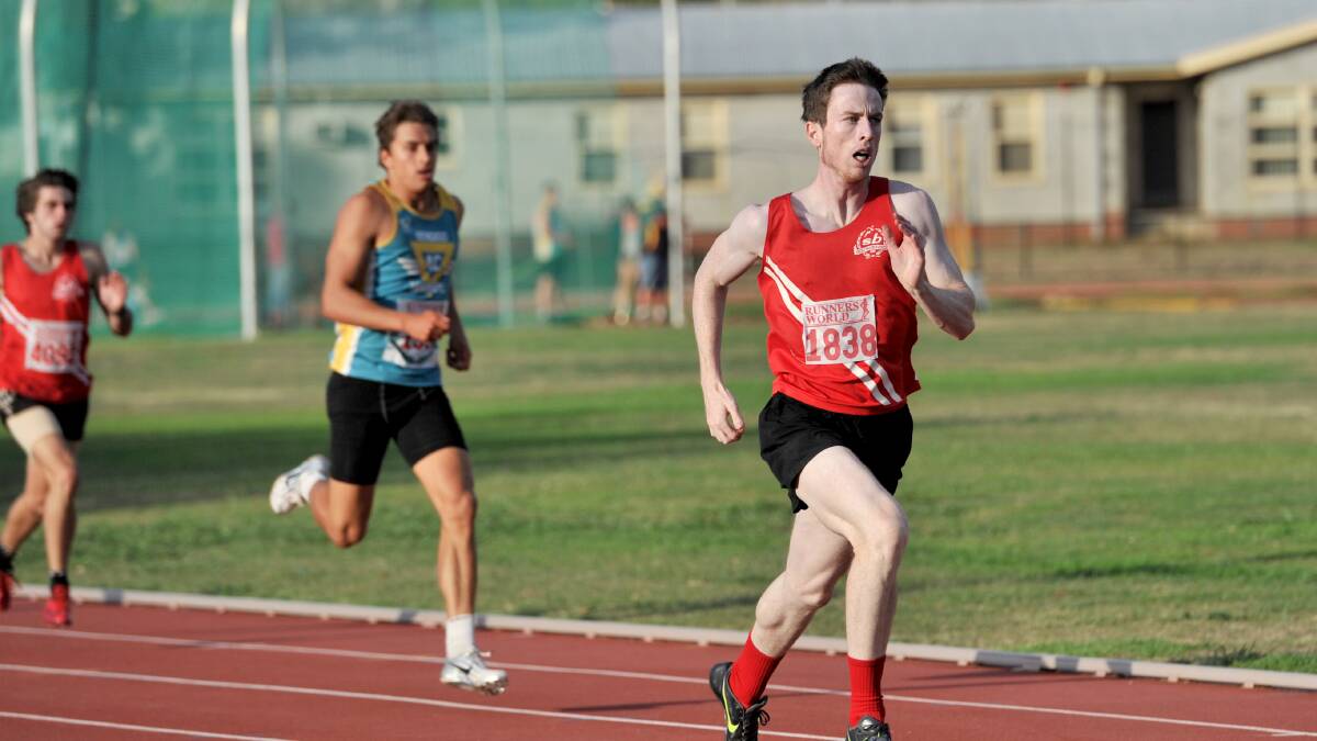 SLICK: South Bendigo's Nigel Self races clear of Bendigo Harriers' Blake Pryse to win the first of the 400m heats. Picture: JODIE DONNELLAN