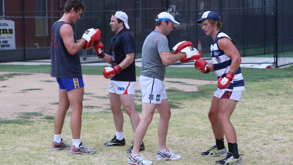 UPPER-CUT: Players do some boxing drills at Sandhurst's pre-season training session at Ewing Park. Picture: PETER WEAVING 