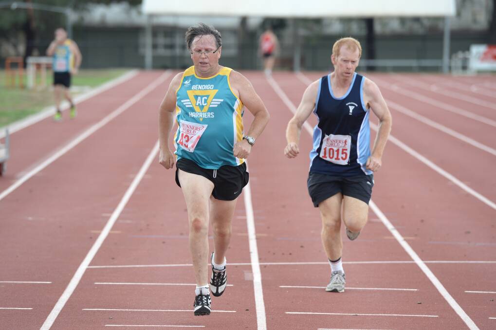 Steve Ryan from Bendigo Harriers wins a closely-fought duel with Eaglehawk's Craig Graham to be second in this 300m heat on the LUBAC track in Flora Hill. 