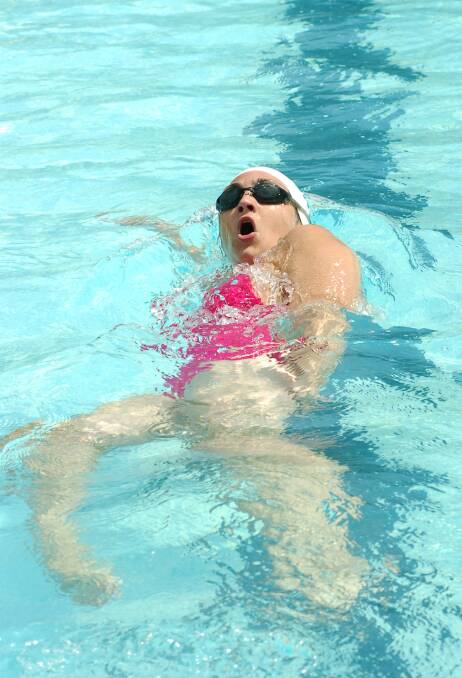 Echuca's Laura Rosin contests backstroke at a championship meet in 2006. 
