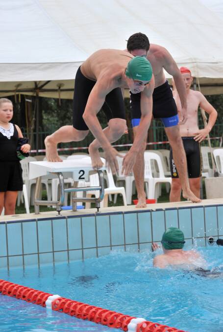 Girton's Jacob Waller dives in to race in the 4 x 50m freestyle relay.
