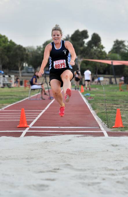 ALL SMILES: Eaglehawk's Casey Crapper competes in long jump. 