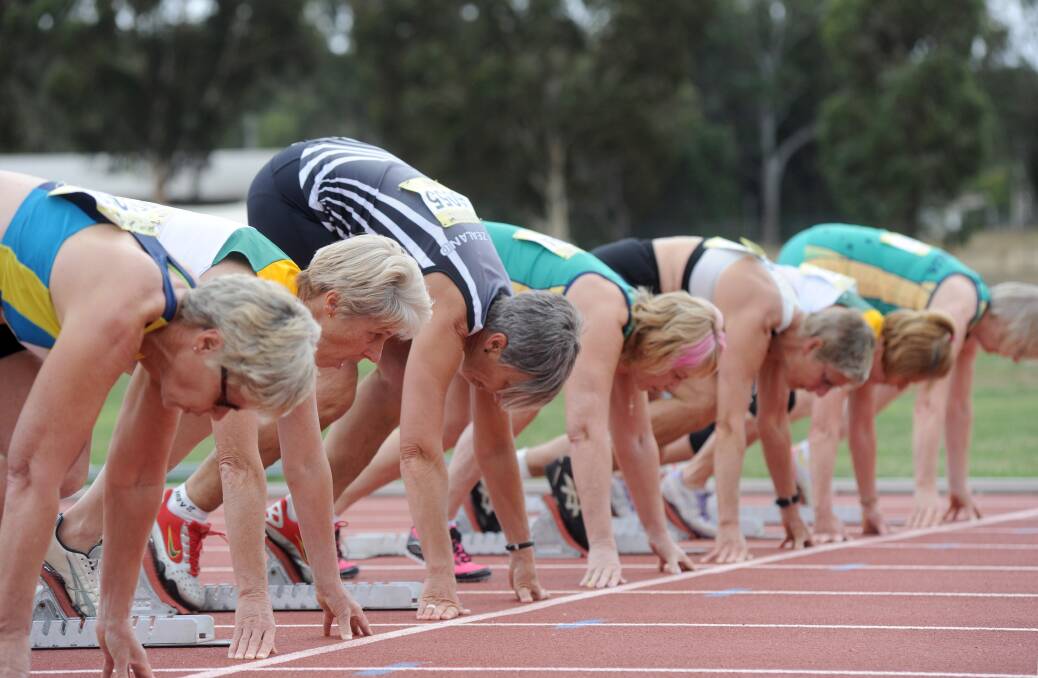 ON YOUR MARKS: Athletes poised for the start of a 60m heat. Pictures: JODIE DONNELLAN 