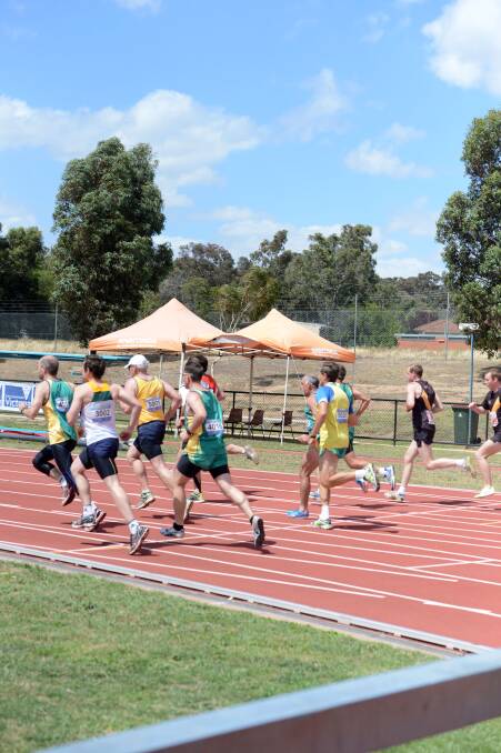 OFF AND RACING: Athletes shortly after the gun has fired for the start of the 1500m leg in the decathlon at the Oceania Masters athletics championships in Bendigo. Picture: LIZ FLEMING 