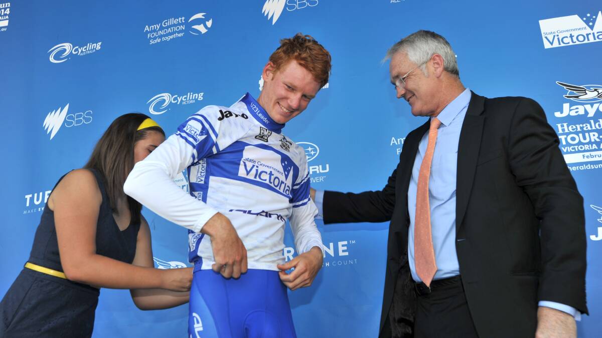 IN THE LEAD: Jack Haig is presented with the Best Young Rider jersey by Damian Drum MLC. Picture: JIM ALDERSEY