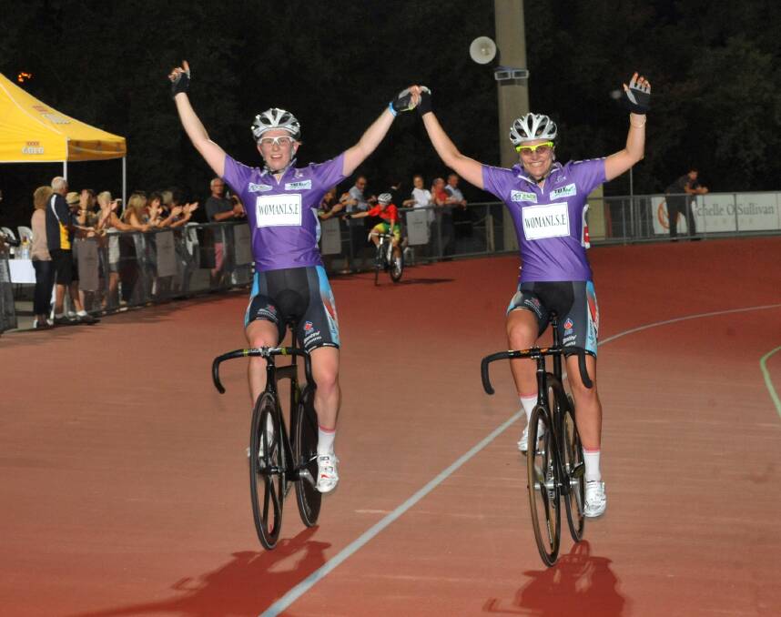 VICTORIOUS: Bella King and Ashlee Ankudinoff after winning the first women's madison at the 2013 Bendigo International Madison carnival. Picture: JULIE HOUGH 