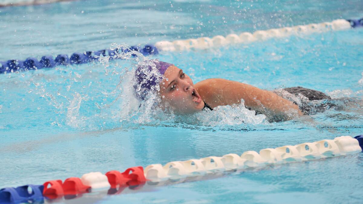 Anna Kollar powers to the finish as she represents Millward house in a 4 x 50m freestyle relay. 