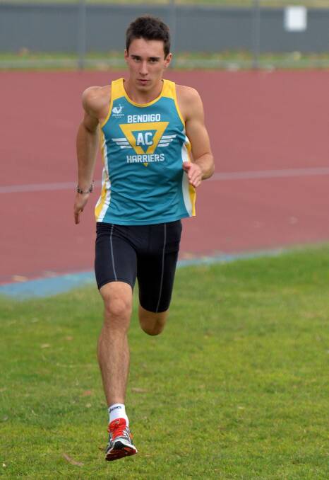 DETERMINATION: Luke Rowlatt sprints around the Tom Flood Sports Centre track. Picture: BRENDAN McCARTHY