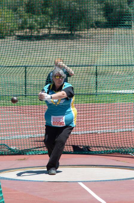 FINE STYLE: Sharon Barr competes in hammer. 