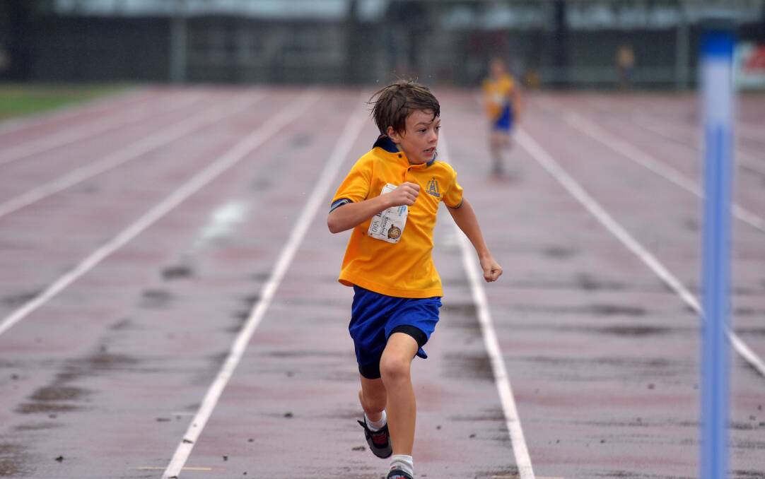 Patrick Hannaford sprints to the gates in the under-9 boys' 200m. 