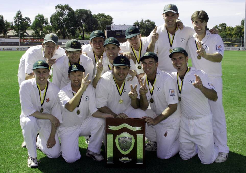 Kangaroo Flat's first XI celebrates after winning the 2004-05 premiership. 