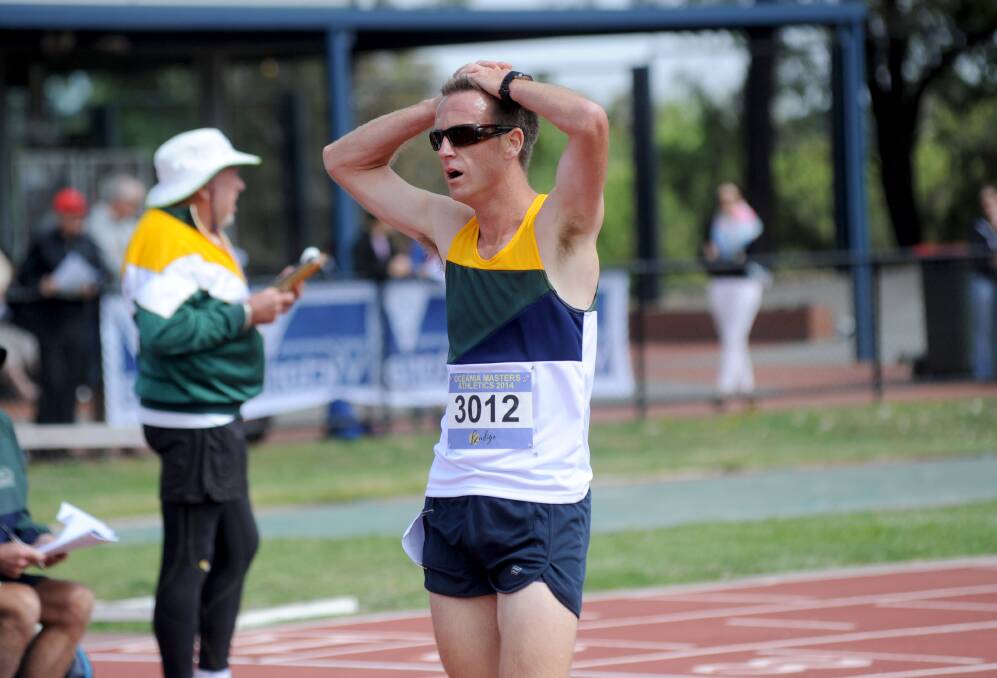 EXHAUSTED: Bendigo's Adam Parker after the 5000m for the 30-34 years class. 