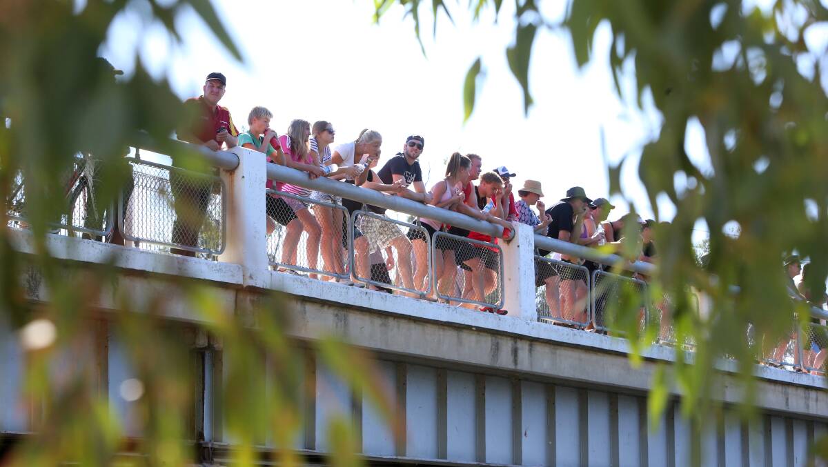 VANTAGE POINT: Spectators watch the swim leg in the Loddon River at Bridgewater. Picture: PETER WEAVING 